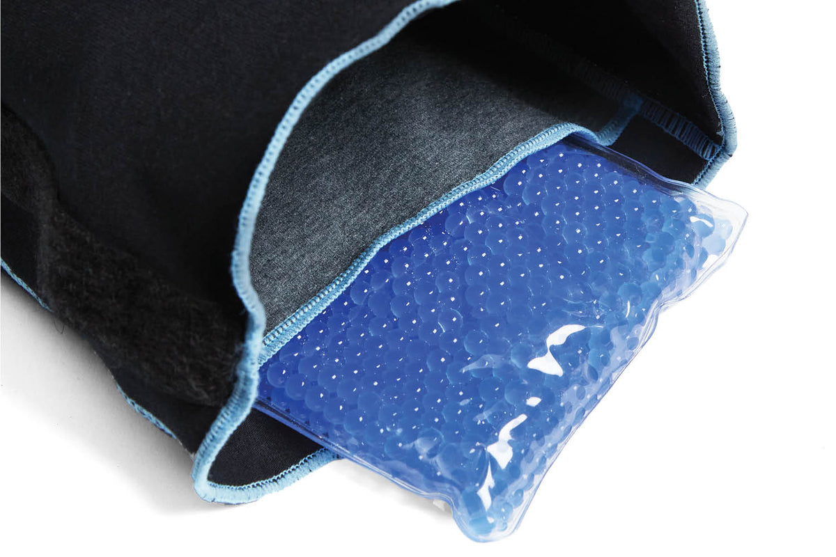 Blue gel ice pack in a black cat protecive recovery suit on a white background